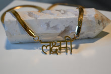 Load image into Gallery viewer, &#39;Lakshmi&#39; written in Hindu. Goddess Lakshmi is the Hindu Goddess of Wealth and Beauty. 14k Gold plated stainless steel herringbone chain, adjustable necklace.
