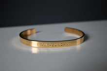 Load image into Gallery viewer, &quot;I AM ABUNDANT&quot; Affirmation engraved in a gold stainless steel cuffed bracelet (bendable)
